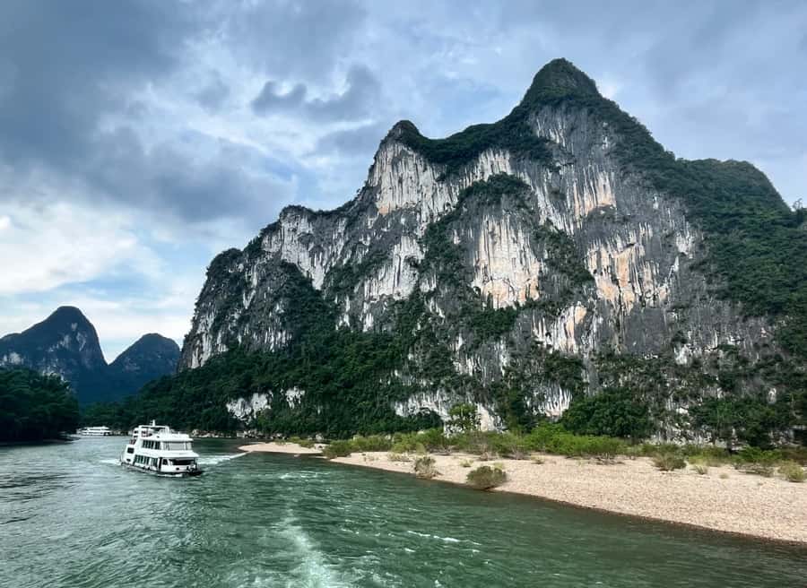 Yangdi Bamboo Rafting, Ancient Stone City& Show Tour - Key Points