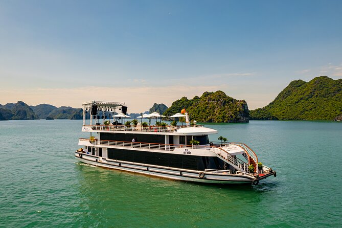 Halong Bay Cruise and Kayaking with Lunch and Music from Hanoi - Exploring Halong Bay’s Iconic Landmarks