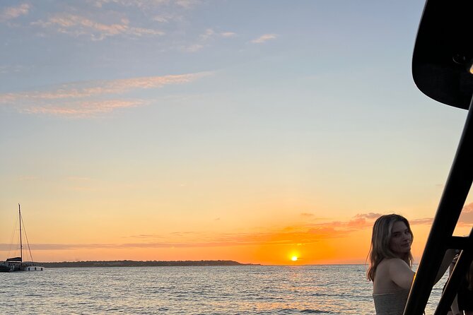 Open bar sunset party in the bay sharing with natives - Key Points