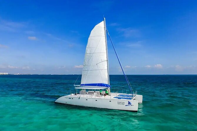 Catamaran to Isla Mujeres Snorkeling, Beach Club and Lunch Tour - Key Points